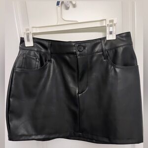 Mini leather skirt with a black button fitted